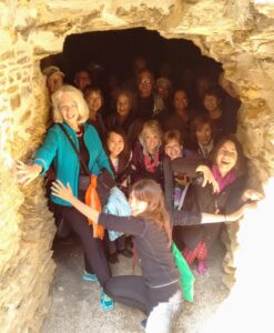 Tour group pretending to be imprisoned in dungeon
